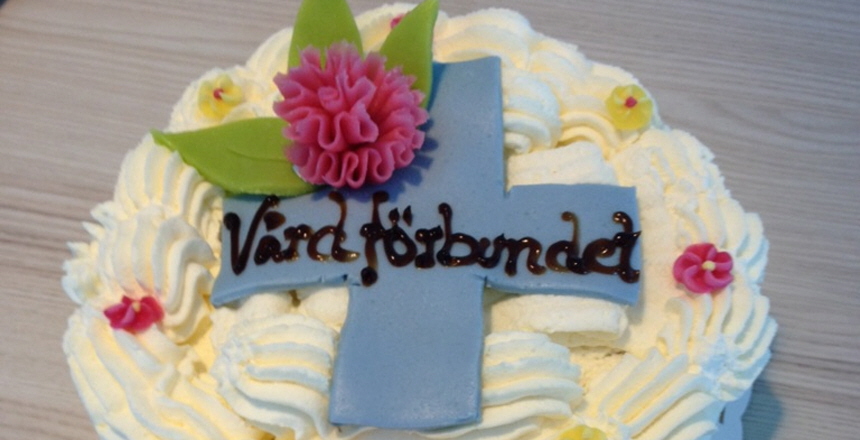 Tårta med ros och text Vårdförbundet